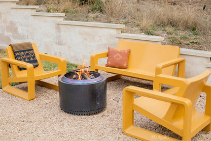 Tupelo Deck Loveseat Marigold and Deck Chair Marigold sitting around a fire pit
