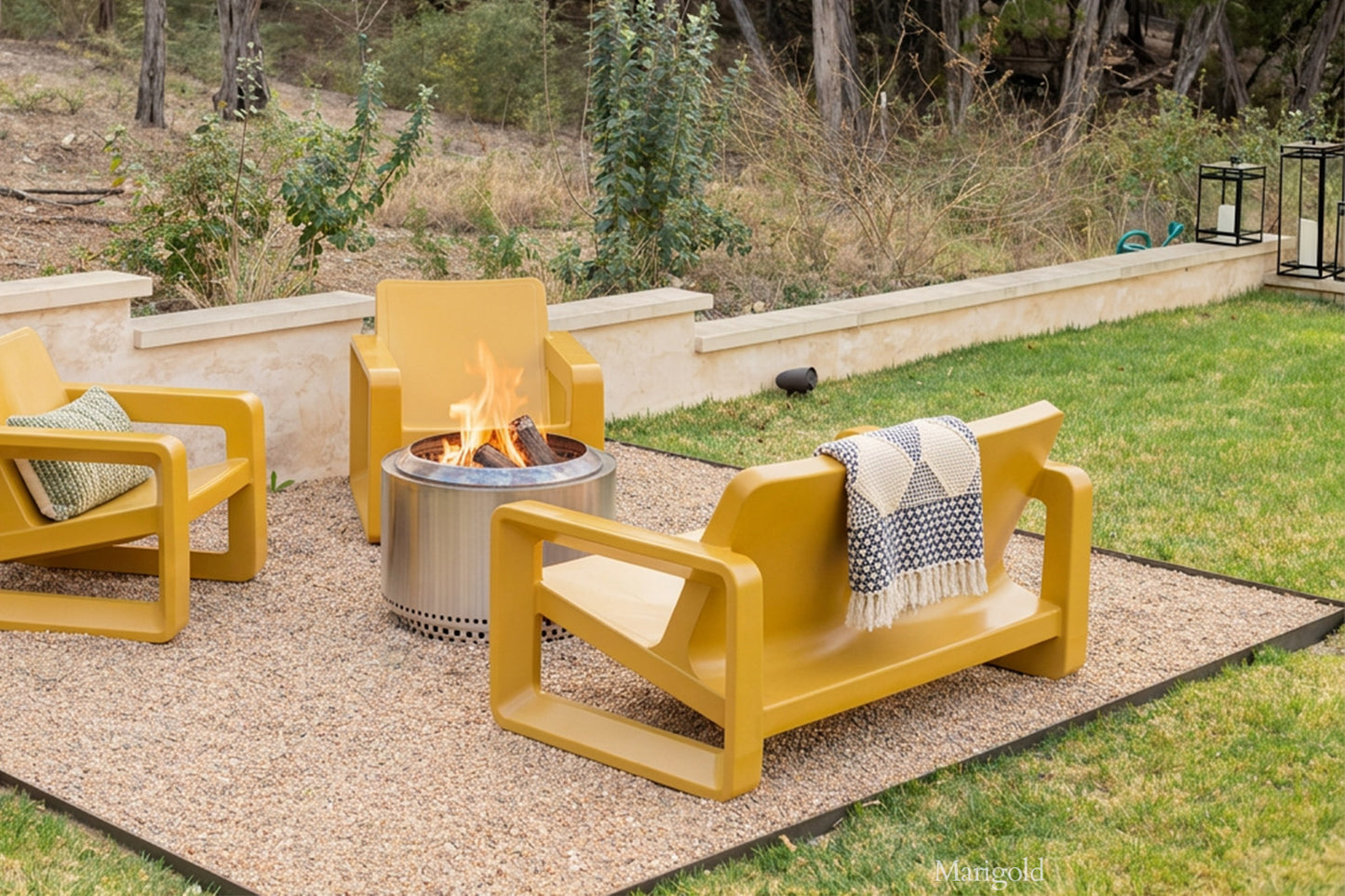 Tupelo Deck Loveseat Marigold and Deck Chair Marigold sitting around a fire pit
