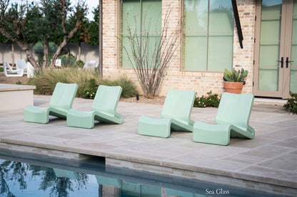 Tupelo Line Chair Sea Glass sitting poolside