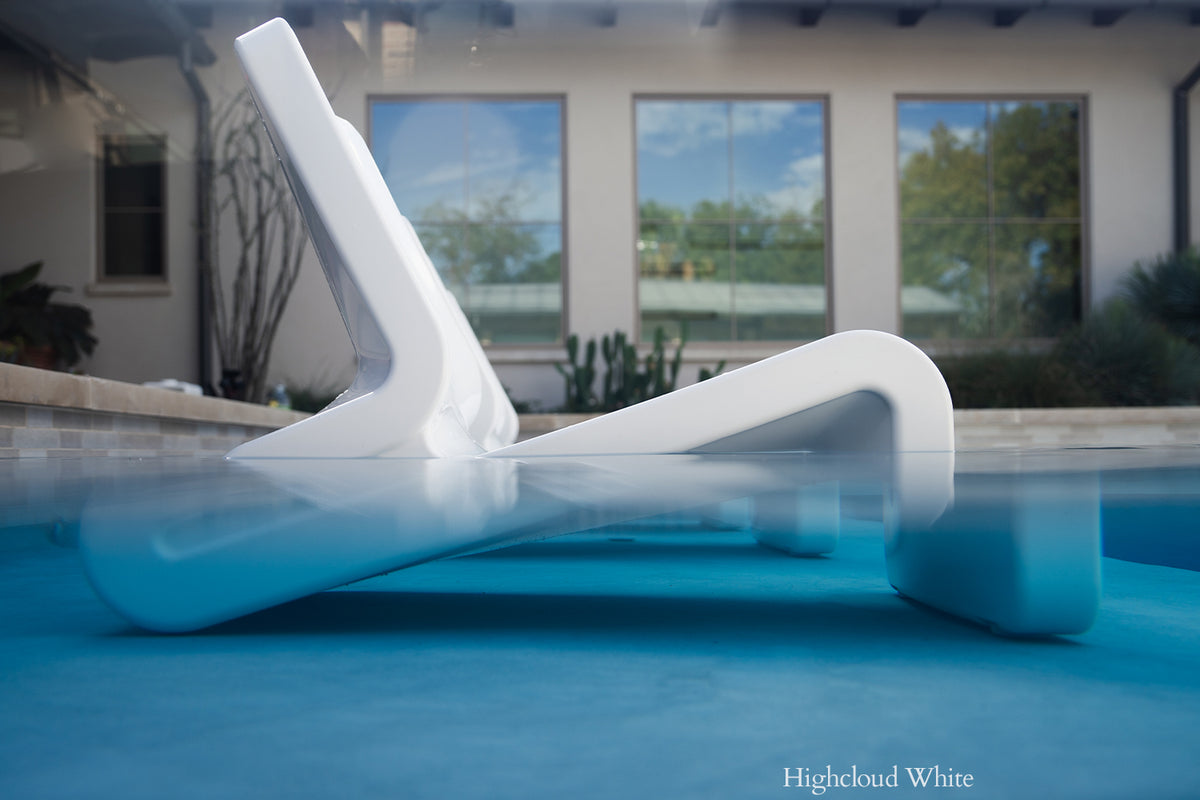 Water-level view of Tupelo Line Chair Highcloud White on a pool shelf