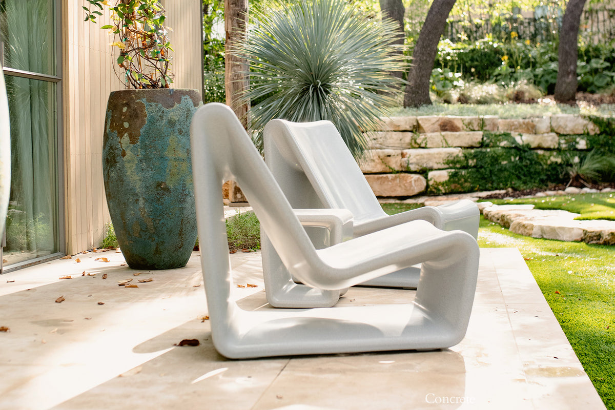 Tupelo Loop Chair Concrete Gray on a patio