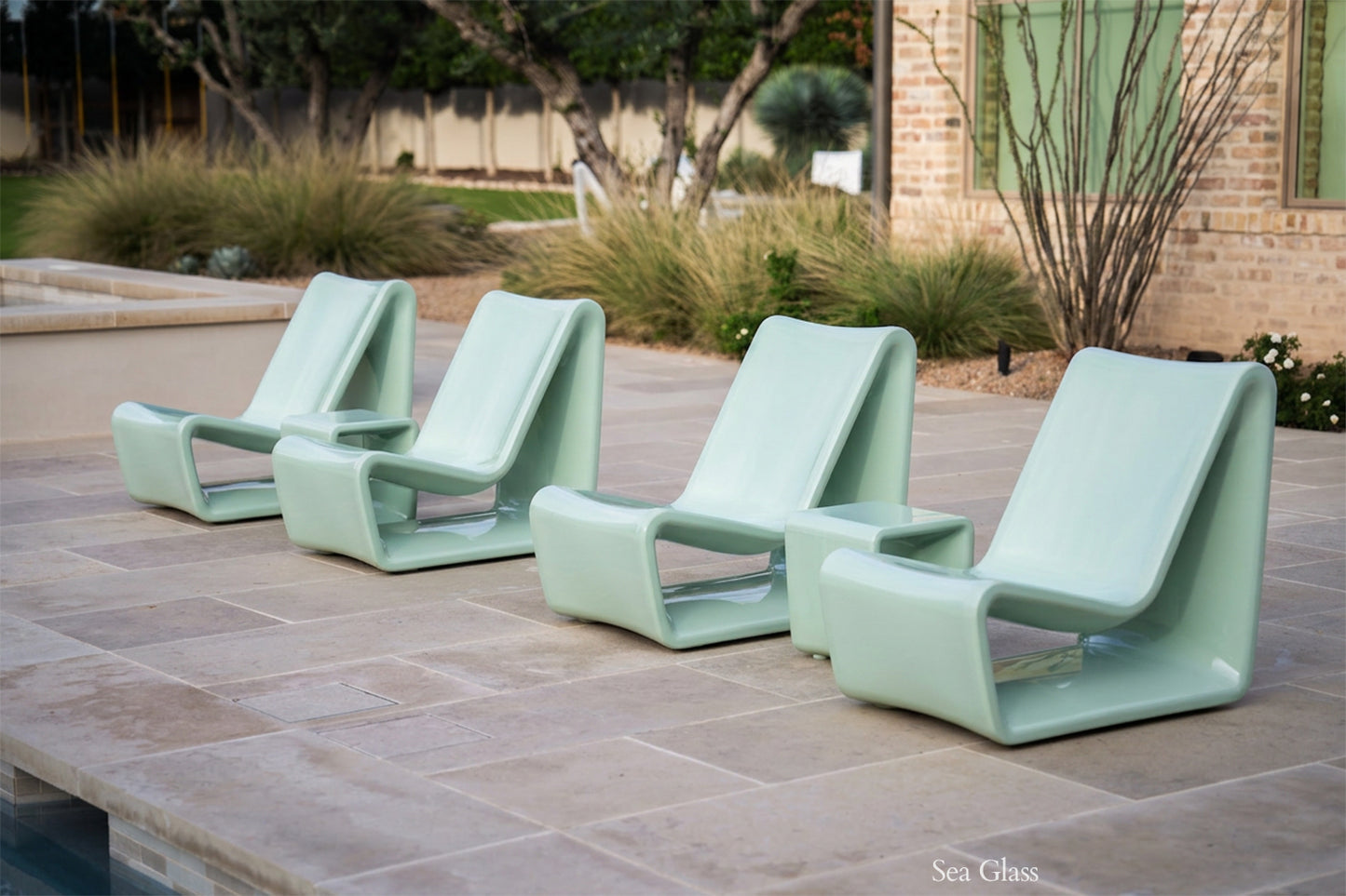 Tupelo Loop Chair Sea Glass sitting poolside