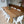 Image of 8 modern Highcloud White Fresco Dining Chairs from marine-grade polyethylene around a wooden indoor dining table. 