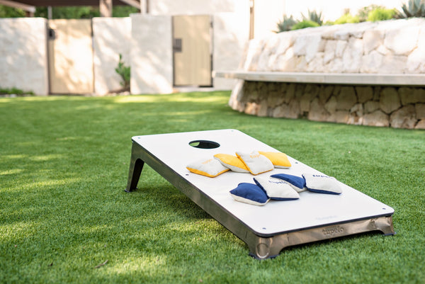 A cornhole board  set to play cornhole game in the backyard. These cornhole boards are waterproof and all-weather.
