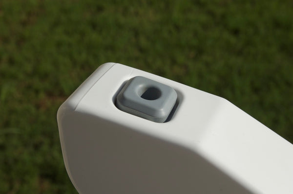 Close-up image of the Bask Loung Chair's foot with rubber to prevent the chair from sliding, in the color Highcloud White.