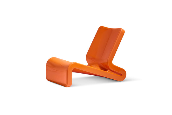 The image shows the UV-resistant, Line Lounge Chair colour in Vintage Orange made with resin, in front of a white background.