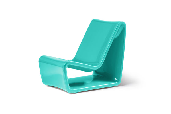 Image of an angled side view of the sleek Seafoam Green Loop Lounge Chair made with polyethylene, shown on a white background.