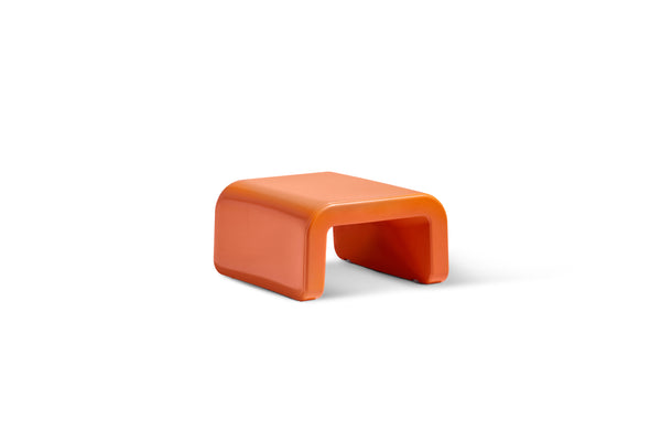 The modern Line Ottoman in the colour Vintage Orange made with marine-grade polyethylene displayed on a white background.